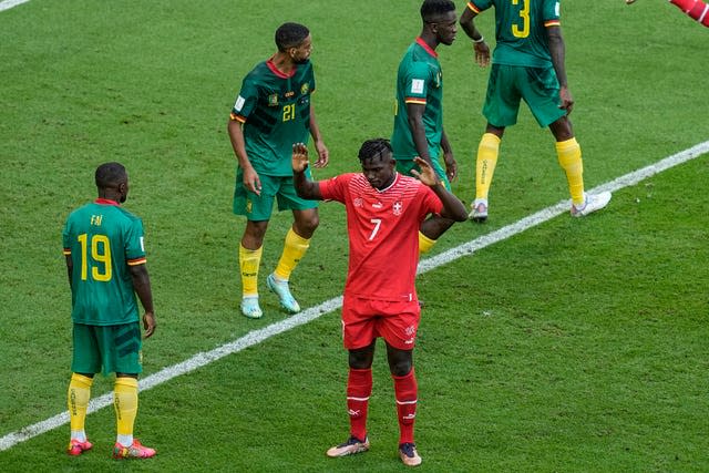 Switzerland’s Breel Embolo holds his hands up after scoring