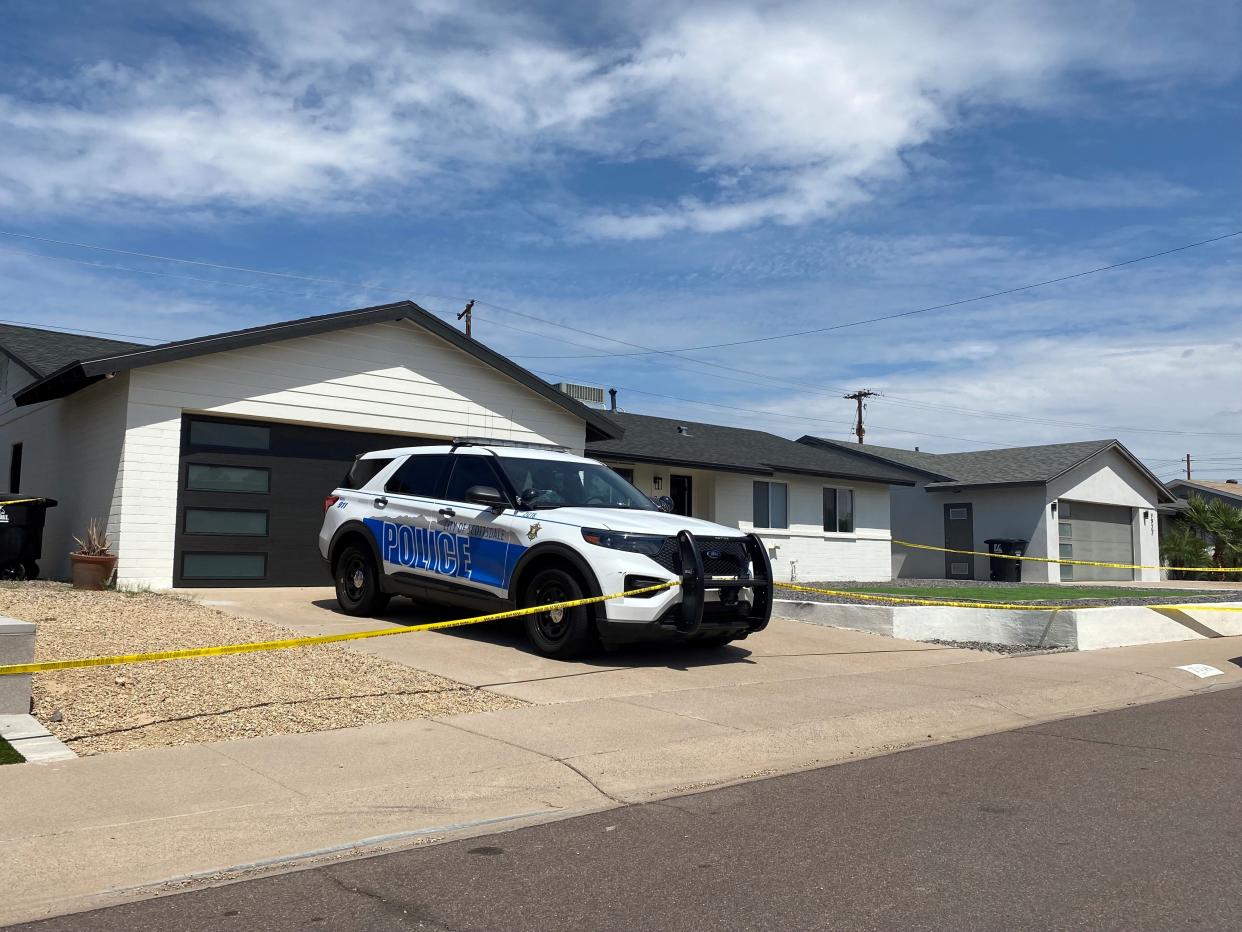 A Scottsdale police vehicle sits parked in front of the short-term rental property where a shooting took place on Sept. 9, 2022.