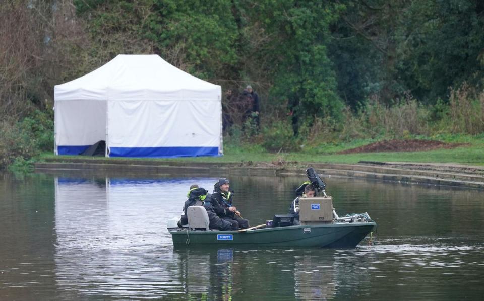 Police search teams on the River Wensum (PA)