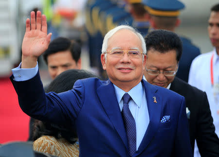 Malaysian Prime Minister Razak Najib waves to photographers upon arrival at the Manila International Airport in Pasay city, metro Manila, Philippines April 27, 2017. REUTERS/Romeo Ranoco