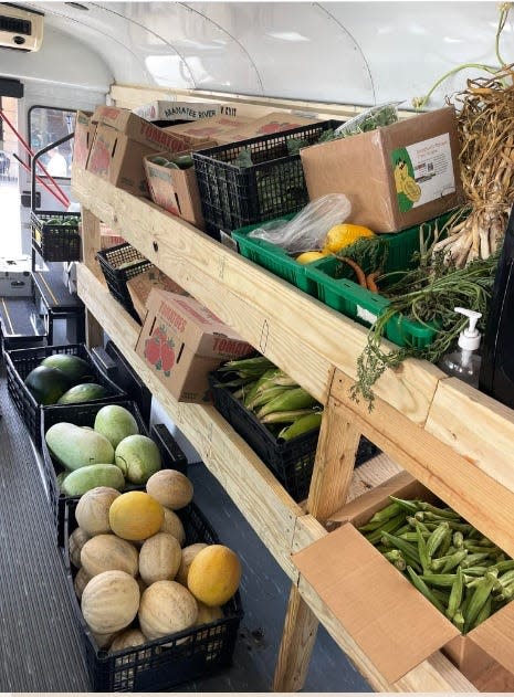 Inside the BattleField Farm & Gardens truck, shelves are laden with fresh produce. July 13, 2022