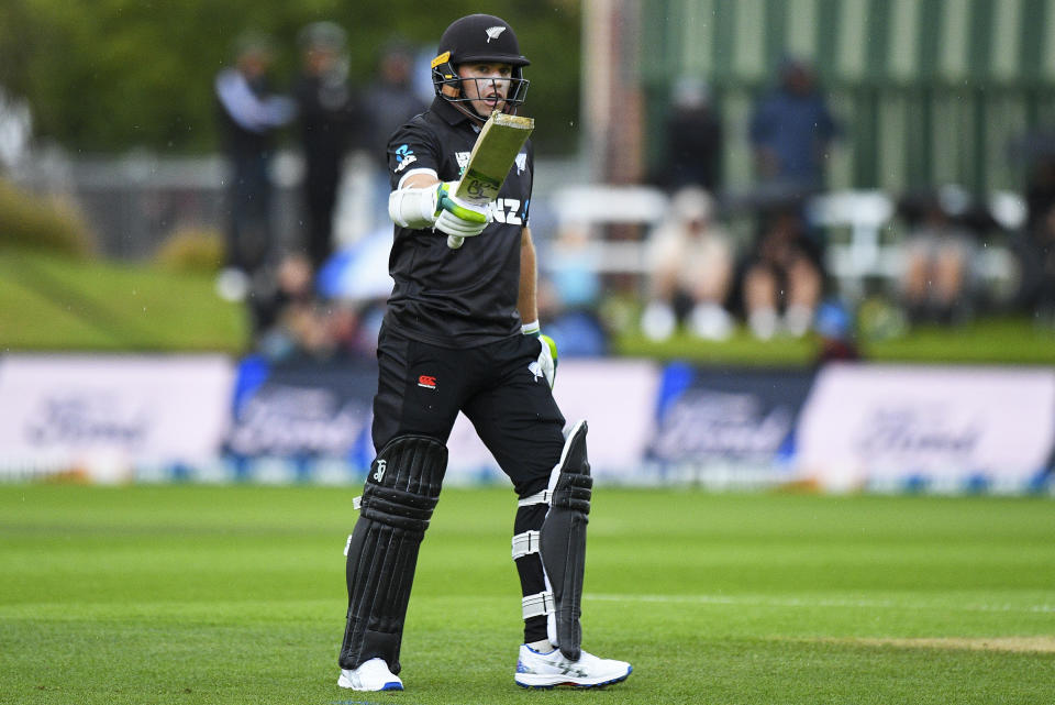 New Zealand's Tom Latham gestures after scoring fifty runs during the one day cricket international between New Zealand and Bangladesh at University Oval in Dunedin, New Zealand, Sunday, Dec. 17, 2023. (Chris Symes/Photosport via AP)