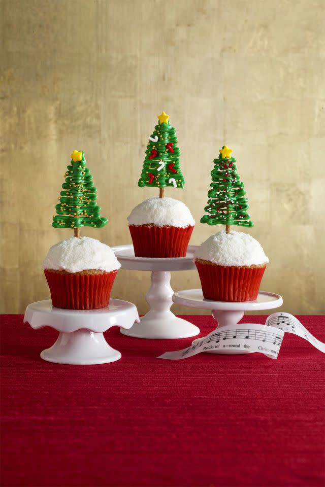 <p>Tiny, candy evergreens are the perfect toppers for these festive cupcakes.</p><p><a href="https://www.womansday.com/food-recipes/recipes/a56903/rockin-around-the-christmas-tree-cupcakes-recipe/" rel="nofollow noopener" target="_blank" data-ylk="slk:Get the recipe.;elm:context_link;itc:0;sec:content-canvas" class="link "><em>Get the recipe.</em></a> </p>