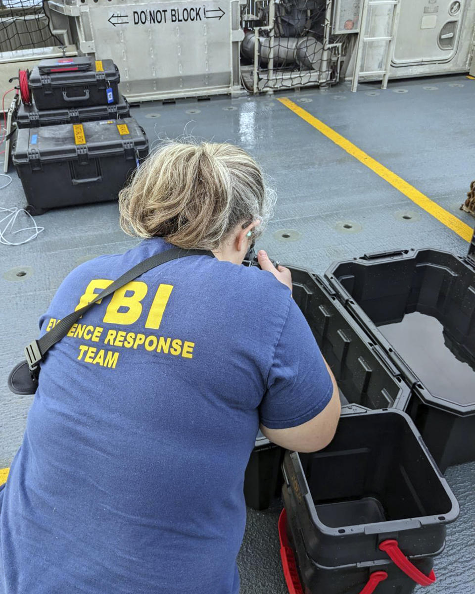 In this image provided by the FBI, an FBI evidence response team photographer captures images of material recovered from the high altitude balloon off the coast of Myrtle Beach, S.C. (FBI via AP)