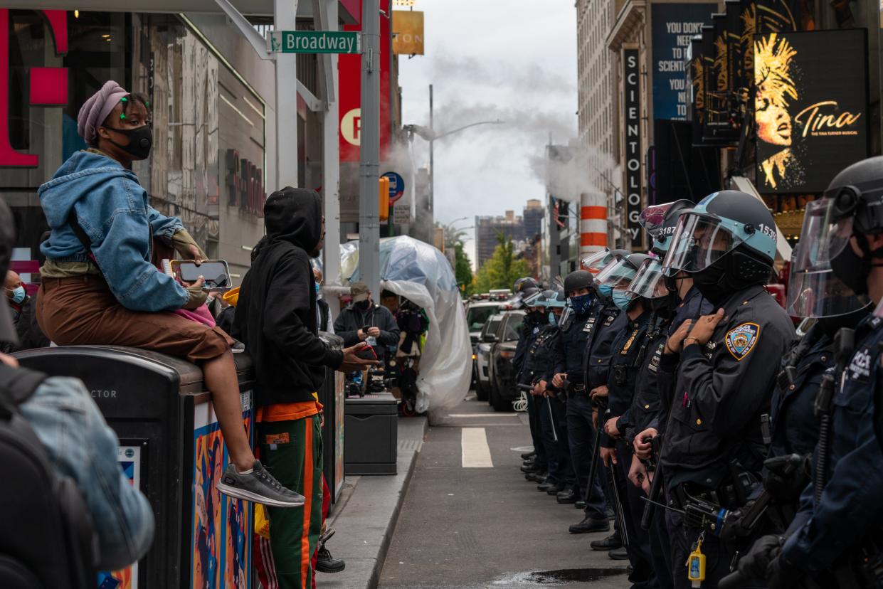 NEW YORK, NY - OCTOBER 25: Officers create a physical barrier to keep Trump supporters and Trump protesters separated at a march and rally for President Donald Trump at Times Square  on October 25, 2020 in New York City. As the November 3rd presidential election nears, Trump supporters and protestors have taken to the streets to be heard. (Photo by David Dee Delgado/Getty Images) (Getty Images)