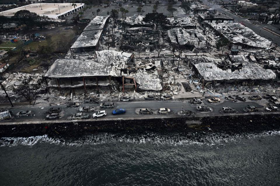 An aerial image taken on August 10, 2023 shows destroyed buildings on the waterfront burned to the ground in Lahaina in the aftermath of wildfires in western Maui, Hawaii. At least 36 people have died after a fast-moving wildfire turned Lahaina to ashes, officials said August 9, 2023 as visitors asked to leave the island of Maui found themselves stranded at the airport. The fires began burning early August 8, scorching thousands of acres and putting homes, businesses and 35,000 lives at risk on Maui, the Hawaii Emergency Management Agency said in a statement. (Photo by Patrick T. Fallon / AFP) (Photo by PATRICK T. FALLON/AFP via Getty Images)