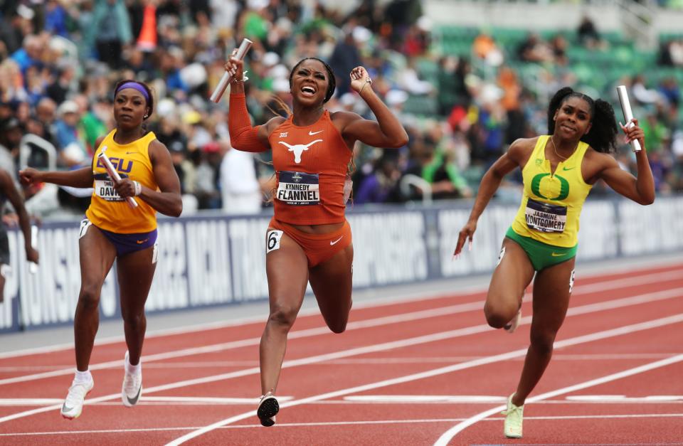 Texas' Kynnedy Flannel, center, celebrates the team win in the women's 4x100 relay withy Jasmine Montgomery, right, finishing third for Oregon on the last day of the NCAA Outdoor Track and Field Championships at Hayward Field Saturday June 12, 2022.