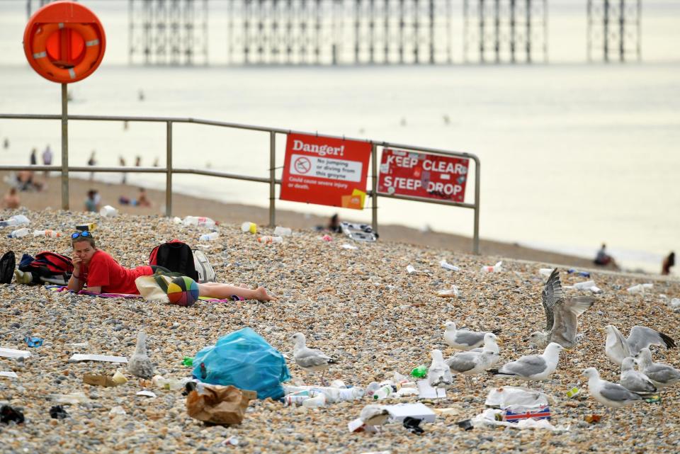 Brighton beach covered in litter on Saturday morning (REUTERS)