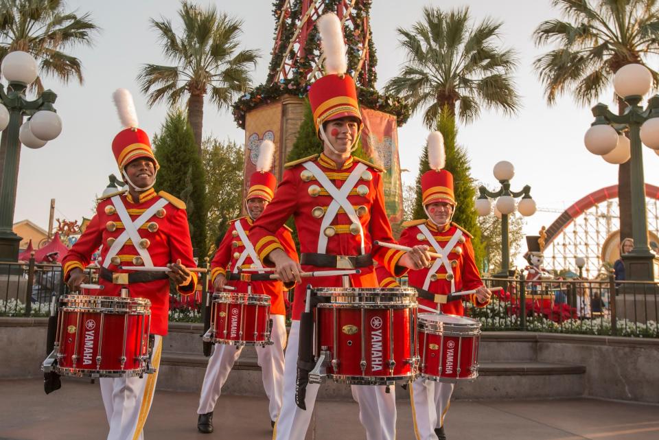 People dressed as Toy soldiers playing the drums