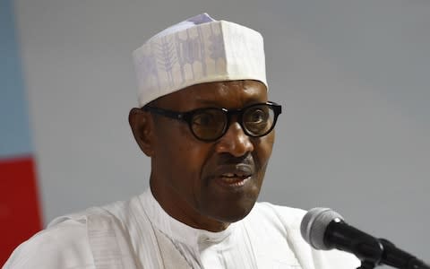 President Mohammadu Buhari delivers a speech during the party caucus emergency meeting on the postponed general elections in Abuja, on February 18, 2019 - Credit: AFP