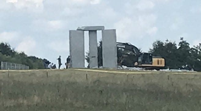 The Georgia Bureau of Investigation bomb squad examines the scene of an early Wednesday explosion at the Georgia Guidestones in Elberton on July 6, 2022.