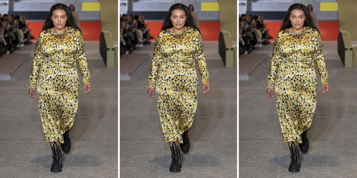 model paloma elsesser walks on the ganni runway to illustrate a roundup of the best plus size clothing 2022