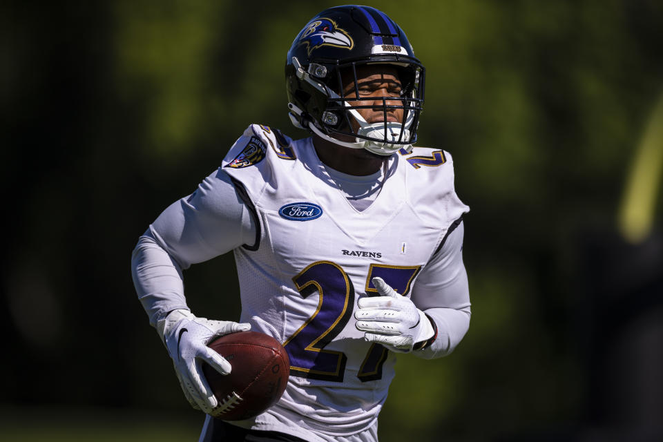 OWINGS MILLS, MD - JUNE 16: J.K. Dobbins #27 of the Baltimore Ravens works out during mandatory minicamp at Under Armour Performance Center on June 16, 2021 in Owings Mills, Maryland. (Photo by Scott Taetsch/Getty Images)