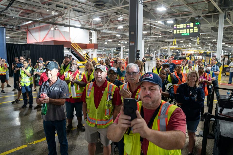 UAW-represented Ford workers to receive profit-sharing checks in 2023 based on Ford's earnings last year in North America. File photo: Ford Michigan Assembly Plant workers at an event on Aug. 10, 2022.
