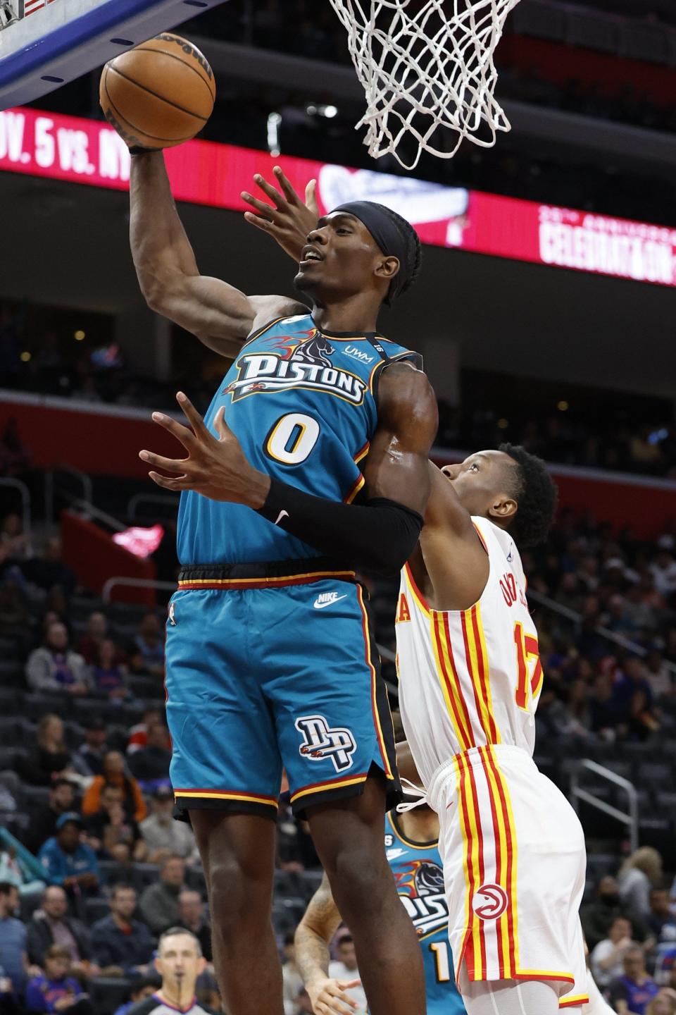 Pistons center Jalen Duren grabs the rebound over Hawks forward Onyeka Okongwu in the first half of the Pistons' 136-112 loss on Friday, Oct. 28, 2022, at Little Caesars Arena.