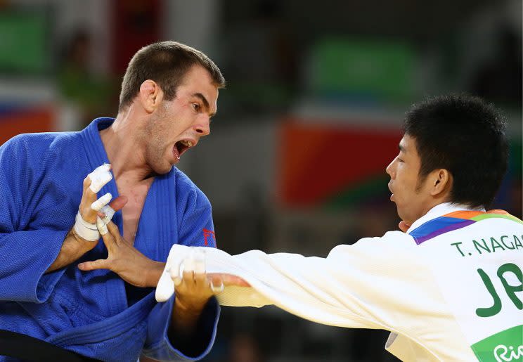 [ RIO DE JANEIRO, BRAZIL - AUGUST 9, 2016: Judokas Antoine Valois-Fortier (L) of Canada and Takanori Nagase of Japan fight in their men's -81kg judo repechage event at the Rio 2016 Summer Olympic Games, at Carioca Arena 2. (Photo by Stanislav KrasilnikovTASS via Getty Images) ]