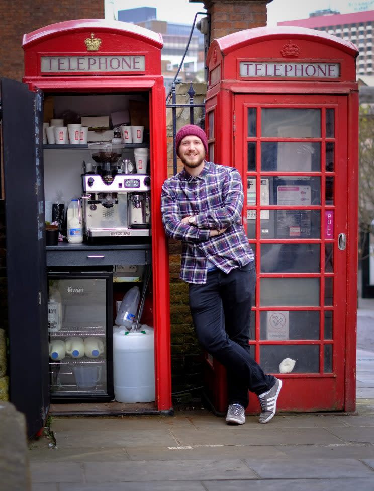 A coffee-loving businessman has opened what could be Britain's smallest cafe - inside a disused red phone box. 