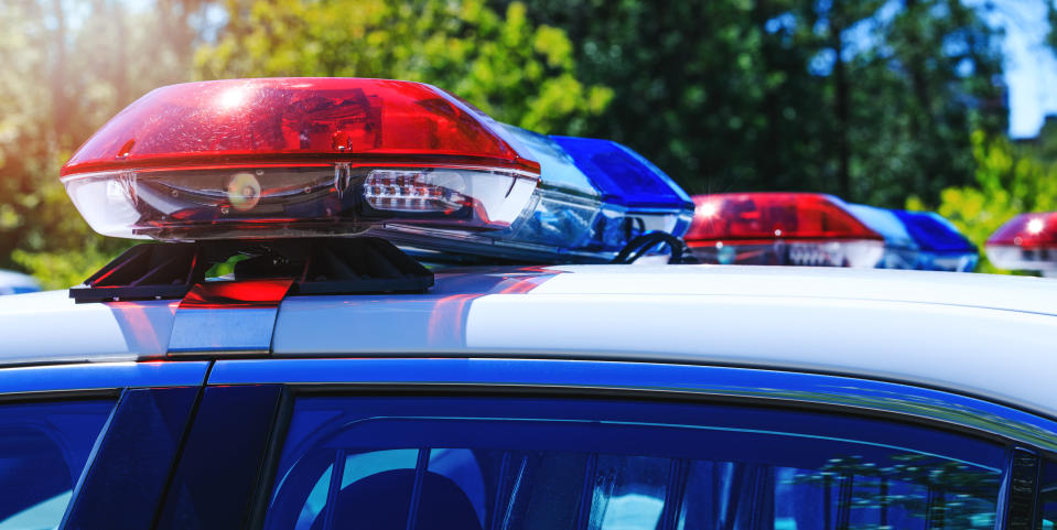 Patrol police car with emergency sirens lights. 