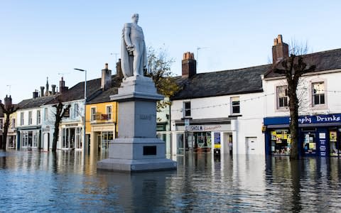 The deserted, flooded streets of Cockermouth after Storm Desmond caused the river to breach its banks - Credit: Toby Smith/Getty Images