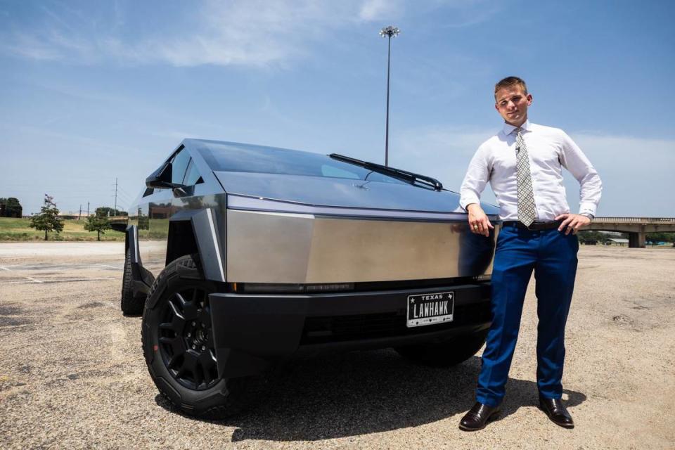 Lawyer and Tesla Cybertruck owner Bryan Willson poses by his car on Friday, August 2, 2024.