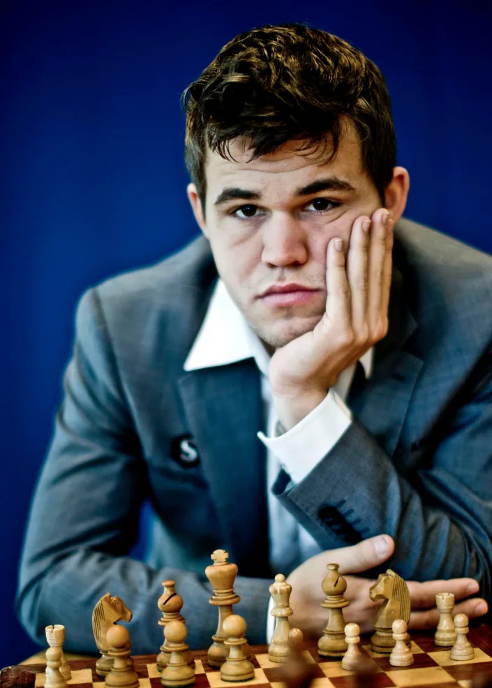 Magnus Carlsen poses for a portrait in front of a chess set in 2013.