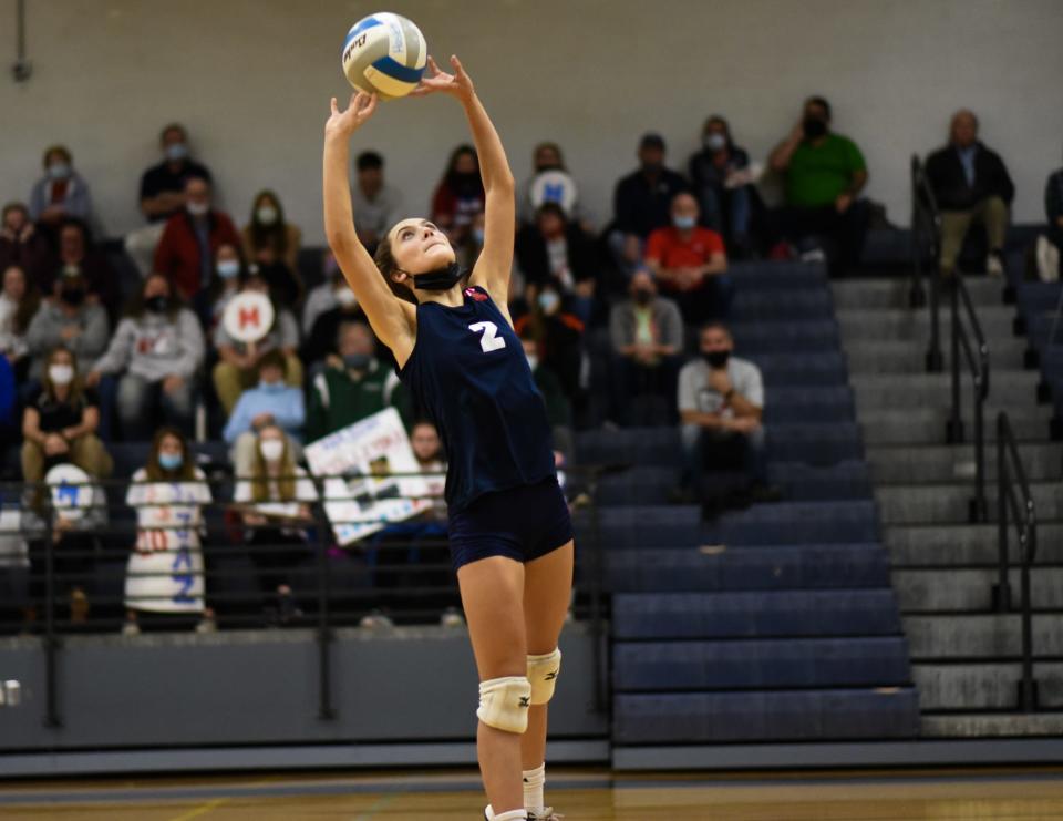 Mason freshman Jocely Shattuck sets the ball against Okemos Monday, Nov. 1, 2021, during the district quarterfinal at Haslett.  Okemos won 3-0.