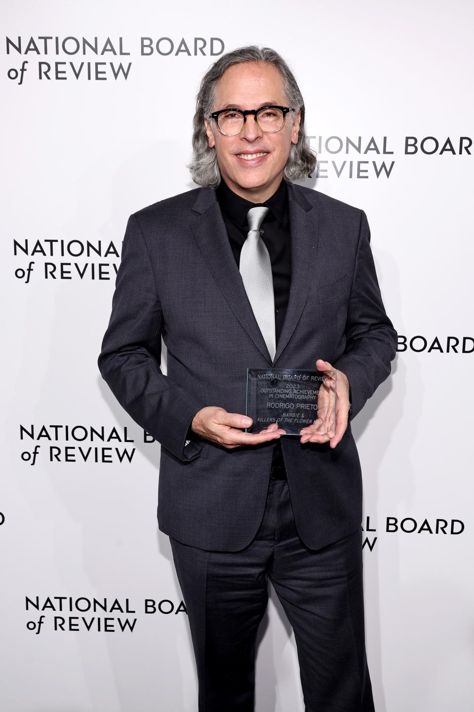 NEW YORK, NEW YORK - JANUARY 11: Rodrigo Prieto poses with the Outstanding Achievement in Cinematography award for "Barbie" and "Killers of the Flower Moon" during the National Board Of Review 2024 Awards Gala at Cipriani 42nd Street on January 11, 2024 in New York City. (Photo by Jamie McCarthy/Getty Images for National Board of Review)