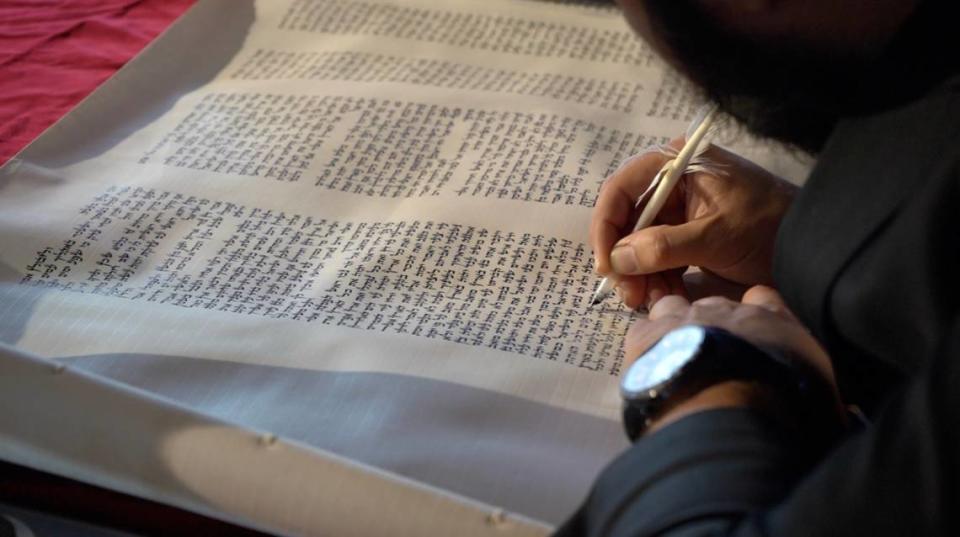 Rabbi Chaim Fyzakov finishes the last lines of the new Torah Scroll for the Rohr Center for Jewish Life-Chabad on Wednesday, Sept. 21, in Bellingham.