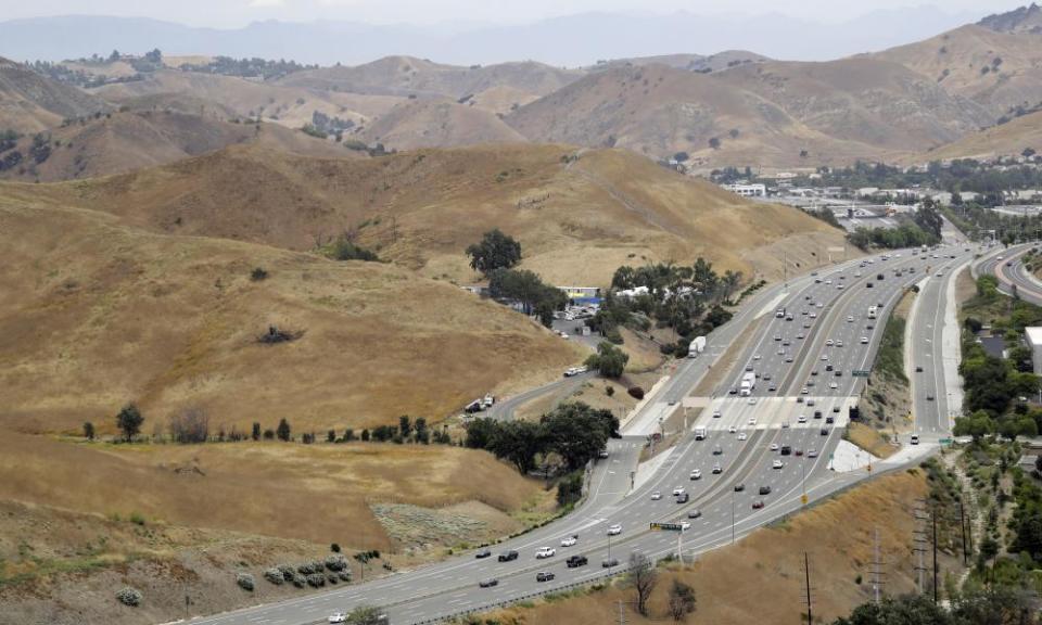 US Highway 101 passes between two separate open space preserves on conservancy lands in the Santa Monica Mountains in Agoura Hills, California.