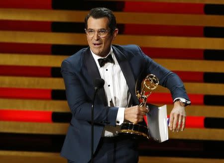 Actor Ty Burrell accepts the award for Outstanding Supporting Actor In A Comedy Series for his role in "Modern Family" onstage during the 66th Primetime Emmy Awards in Los Angeles, California August 25, 2014. REUTERS/Mario Anzuoni
