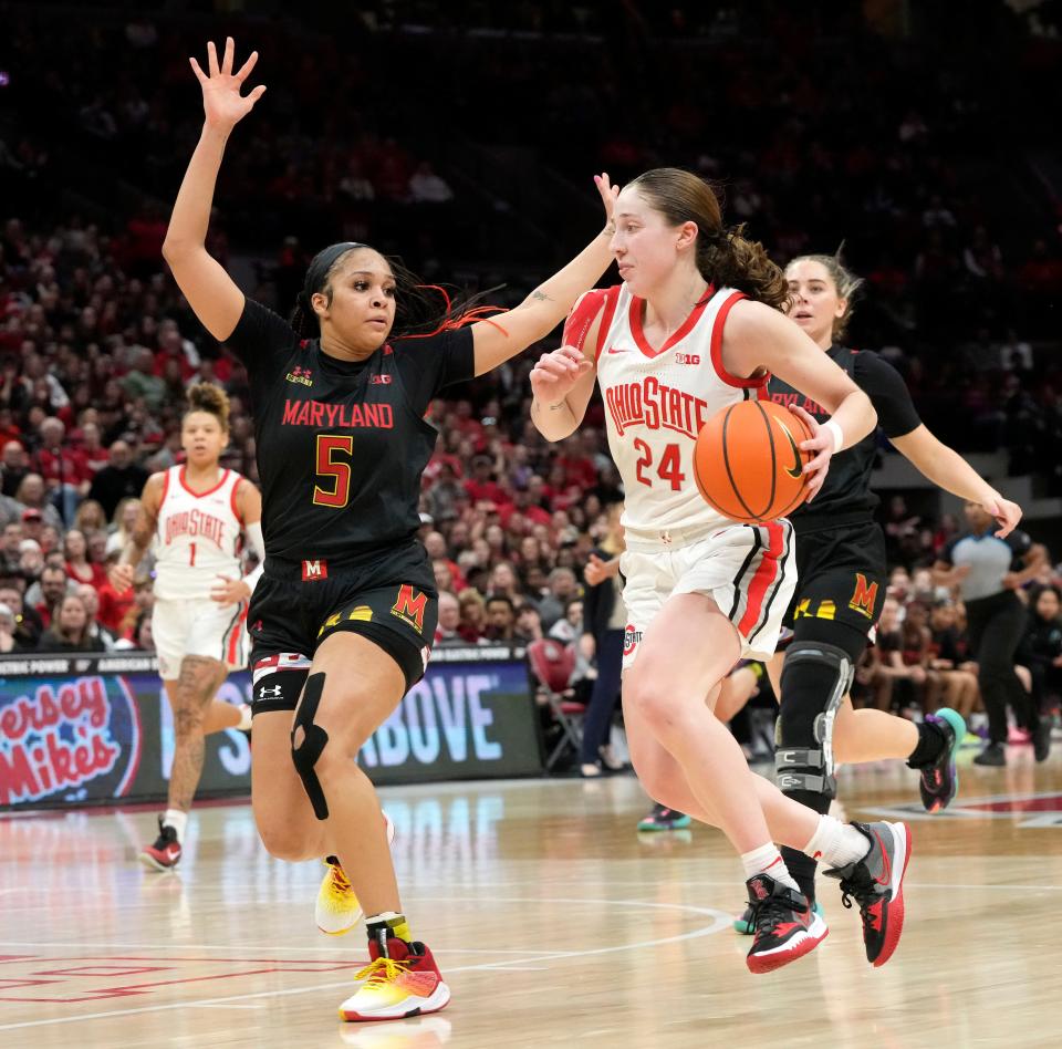Feb. 24, 2023; Columbus, Ohio, USA; Ohio State Buckeyes guard Taylor Mikesell (24) is guarded by Maryland Terrapins guard Brinae Alexander (5) during the second half of Thursday's basketball game at Value City Arena. Maryland won the game 76-74.Mandatory Credit: Barbara J. Perenic/Columbus Dispatch
