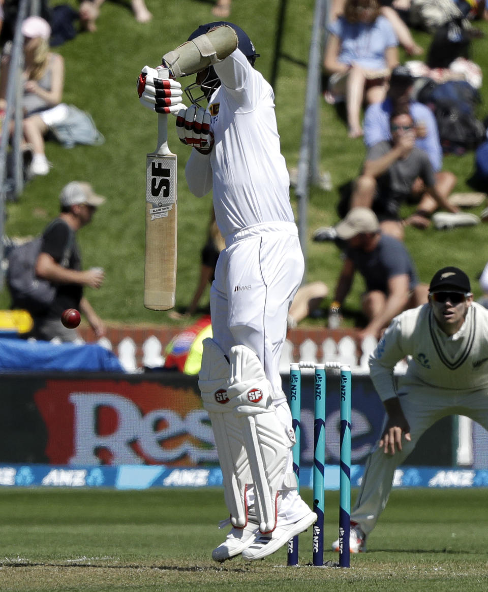 Sri Lanka's Dinesh Chandimal fends at the ball during play on day one of the first cricket test against New Zealand in Wellington, New Zealand, Saturday, Dec. 15, 2018. (AP Photo/Mark Baker)
