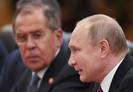 Russian President Vladimir Putin speaks during a meeting with Chinese President Xi Jinping (not seen) in the Great Hall of the People in Beijing, China June 8, 2018. Greg Baker/ Pool via REUTERS