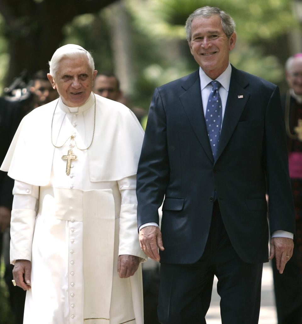 FILE - In this June 13, 2008 file photo, President George W. Bush walks with Pope Benedict XVI to the Lourdes Grotto at the Vatican. President Joe Biden is scheduled to meet with Pope Francis on Friday, Oct. 29, 2021. Biden is only the second Catholic president in U.S. history. (AP Photo/Evan Vucci, File)