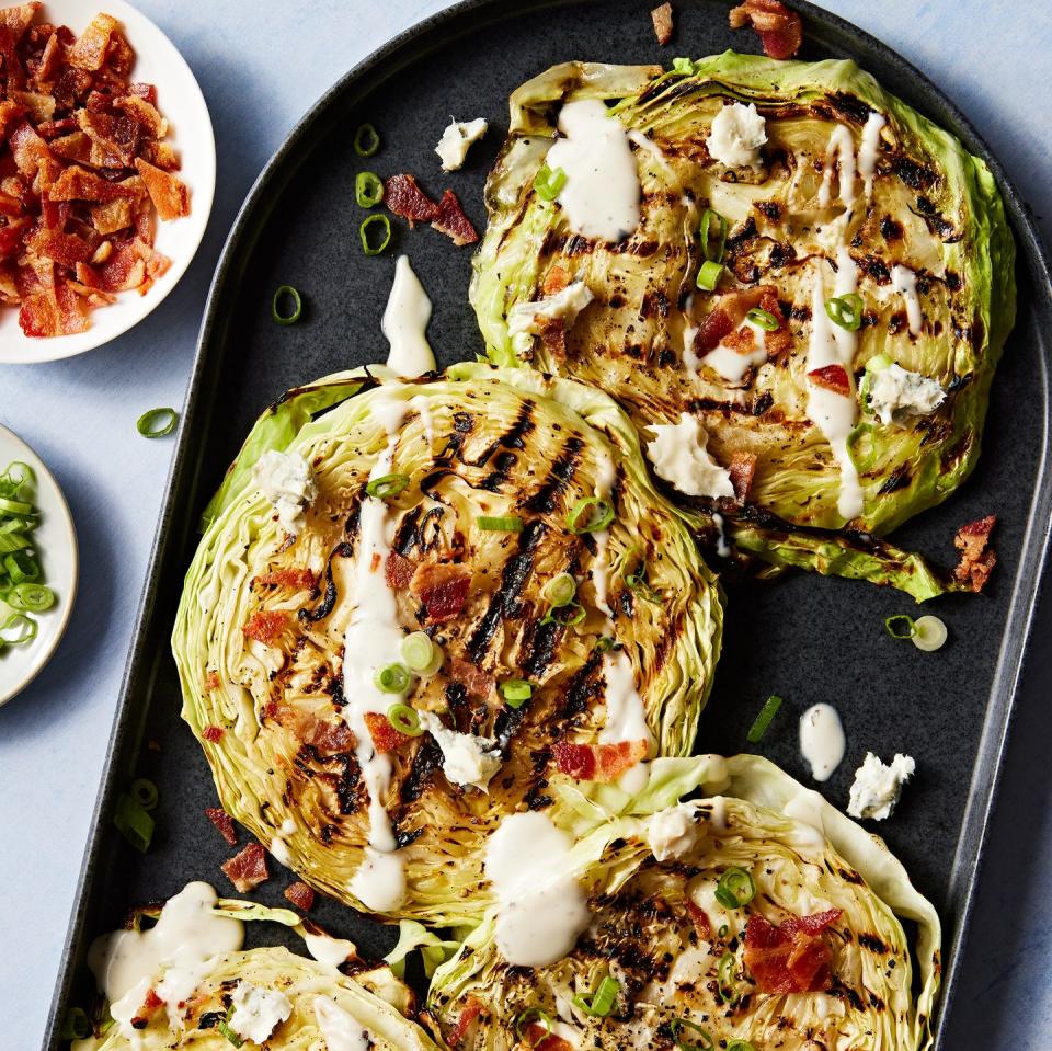 grilled cabbage steaks topped with bacon, sour cream and chives