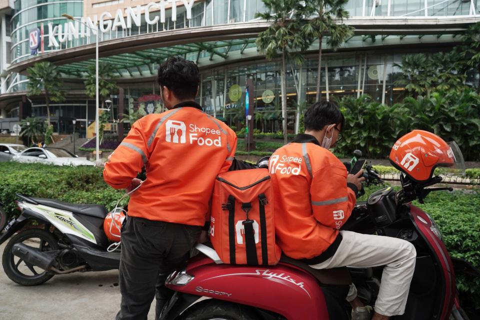 Shopee Food delivery riders wait in Jakarta, Indonesia, on Monday, March 15, 2021.