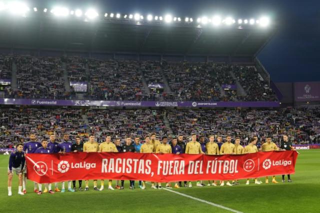 Players from Barcelona and Real Valladolid held an anti-racism message before the game