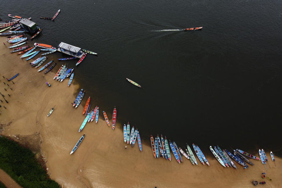 Riverside family boats sit on the beach in the city of Mocajuba, on the banks of the Tocantins River, in the municipality of Mocajuba, Para state, Brazil, Saturday, June 3, 2023. (AP Photo/Eraldo Peres)