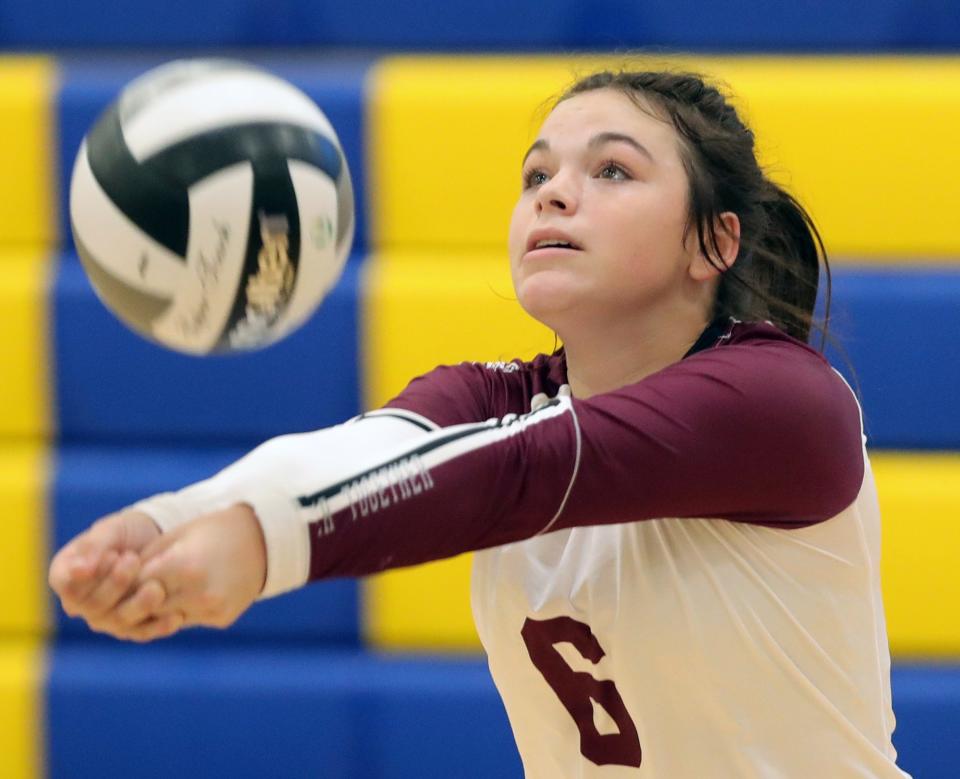 Woodridge's Catie Patterson bumps the ball back over the net during a match at Coventry on Sept. 7, 2021, in Coventry Township.