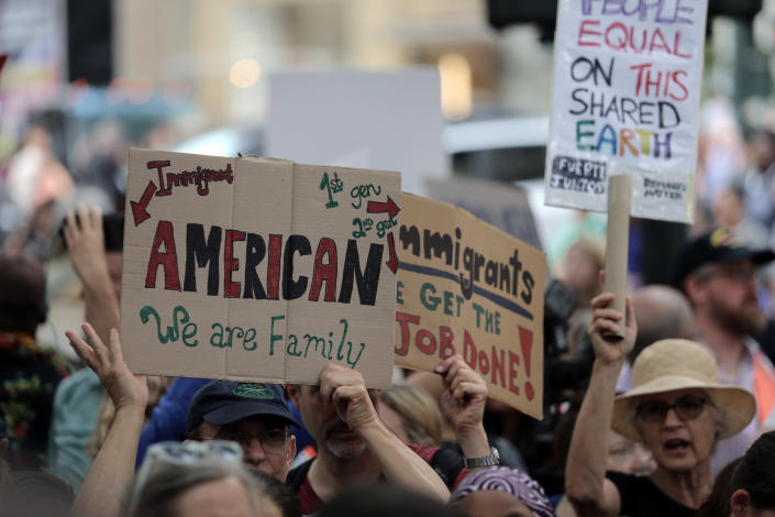 <p>Protesters hold up signs at a protest against the U.S. immigration policies outside the New York Public Library on 42nd Street in New York City on June 20, 2018. (Photo: Gordon Donovan/Yahoo News) </p>