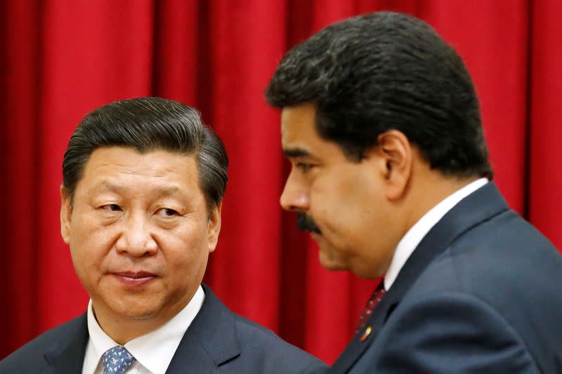 FILE PHOTO: FILE PHOTO: China's President Xi attends a meeting with Venezuela's President Maduro at Miraflores Palace in Caracas