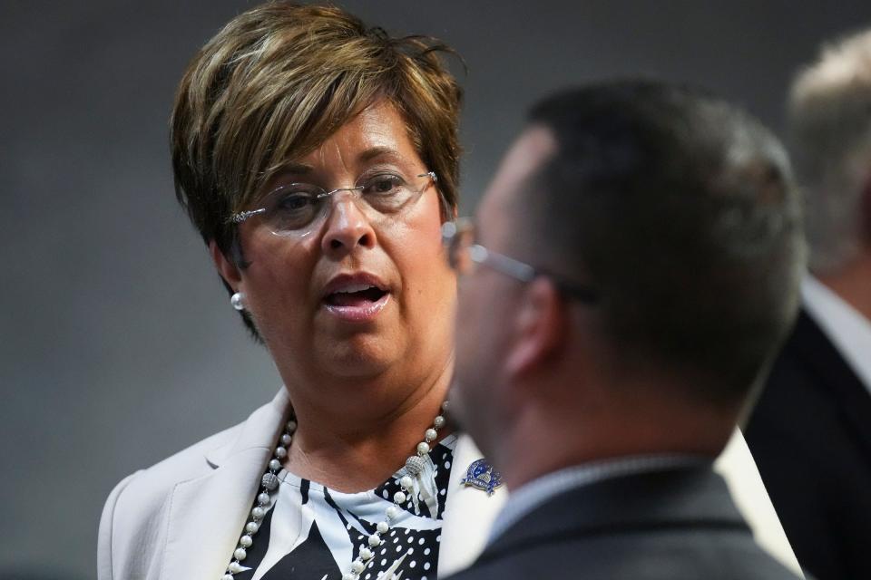 Sen. Stacey A. Donato talks with a fellow lawmaker on Monday, Jan. 8, 2024, the first day of legislative session at the Indiana Statehouse in Indianapolis.