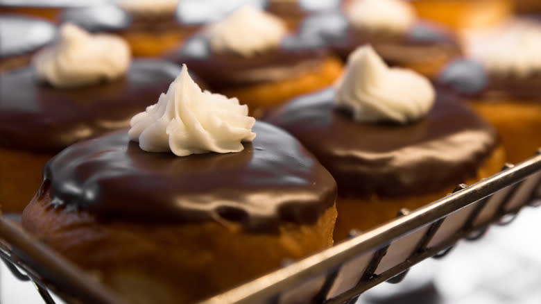 Boston cream donuts on rack