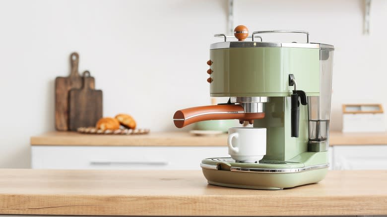 green coffee maker on counter