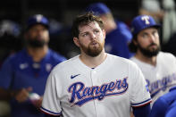 Texas Rangers starting pitcher Jordan Montgomery walks through the dugout after being pulled during the sixth inning in Game 5 of the baseball American League Championship Series against the Houston Astros Friday, Oct. 20, 2023, in Arlington, Texas. (AP Photo/Godofredo A. Vásquez)