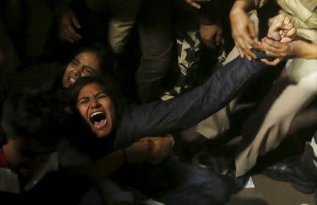 A demonstrator is detained by police during a protest against the release of a juvenile rape convict, in New Delhi, India, December 20, 2015. REUTERS/Adnan Abidi