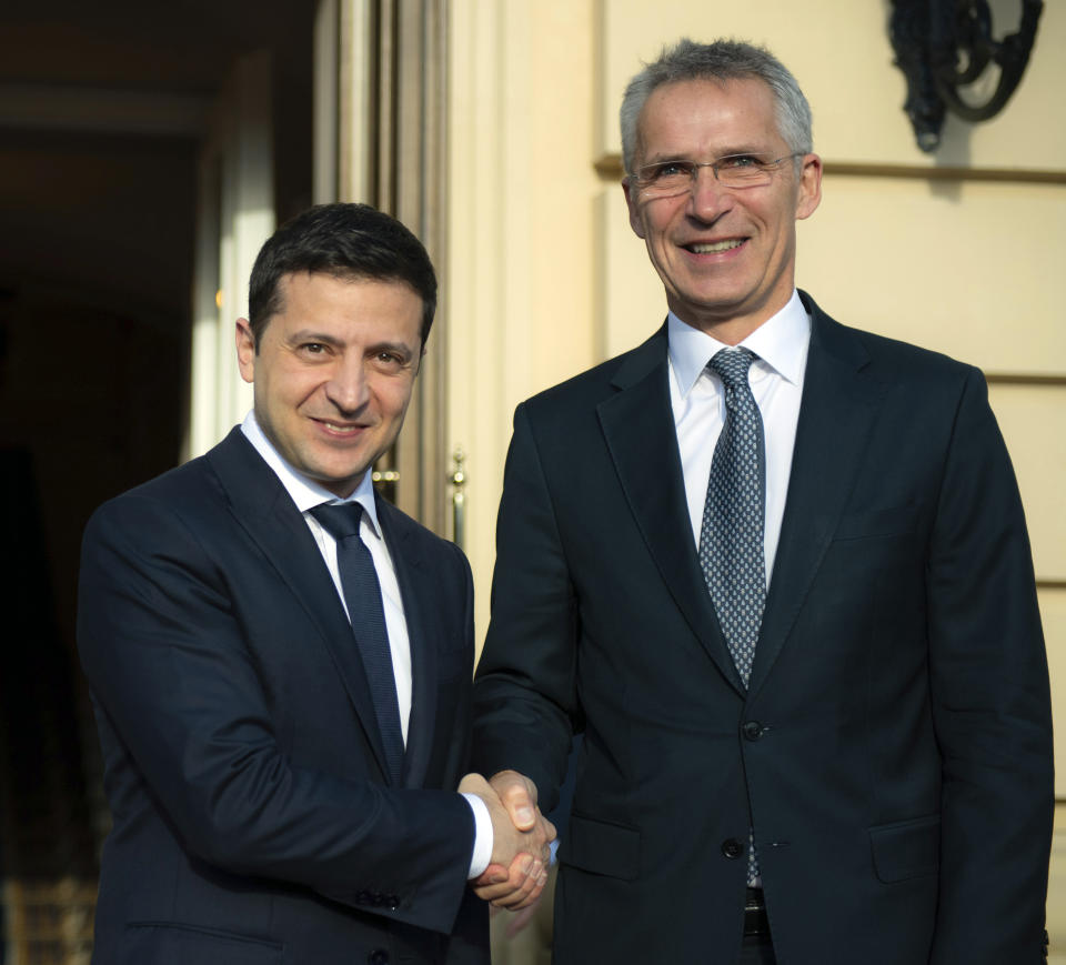 Ukrainian President Volodymyr Zelenskiy, left, welcomes NATO Secretary General Jens Stoltenberg during their meeting in Kyiv, Ukraine, Thursday, Oct. 31, 2019. (Ukrainian Presidential Press Office via AP)