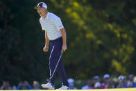 Jordan Spieth reacts aftering winning the hole during their fourball match at the Presidents Cup golf tournament at the Quail Hollow Club, Friday, Sept. 23, 2022, in Charlotte, N.C. (AP Photo/Julio Cortez)