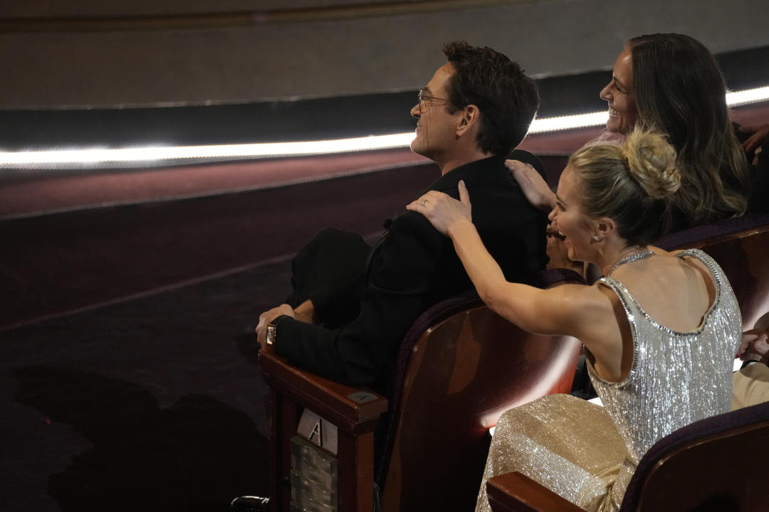 Robert Downey Jr., left, and Emily Blunt appear in the audience during the Oscars on Sunday, March 10, 2024, at the Dolby Theater in Los Angeles.  (AP Photo/Chris Pizzello)