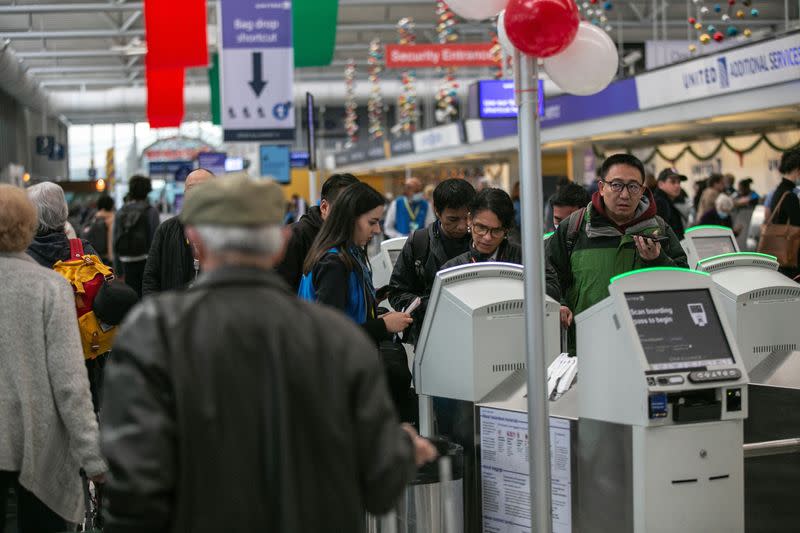 Passengers wait for the resumption of flights at O'Hare International Airport